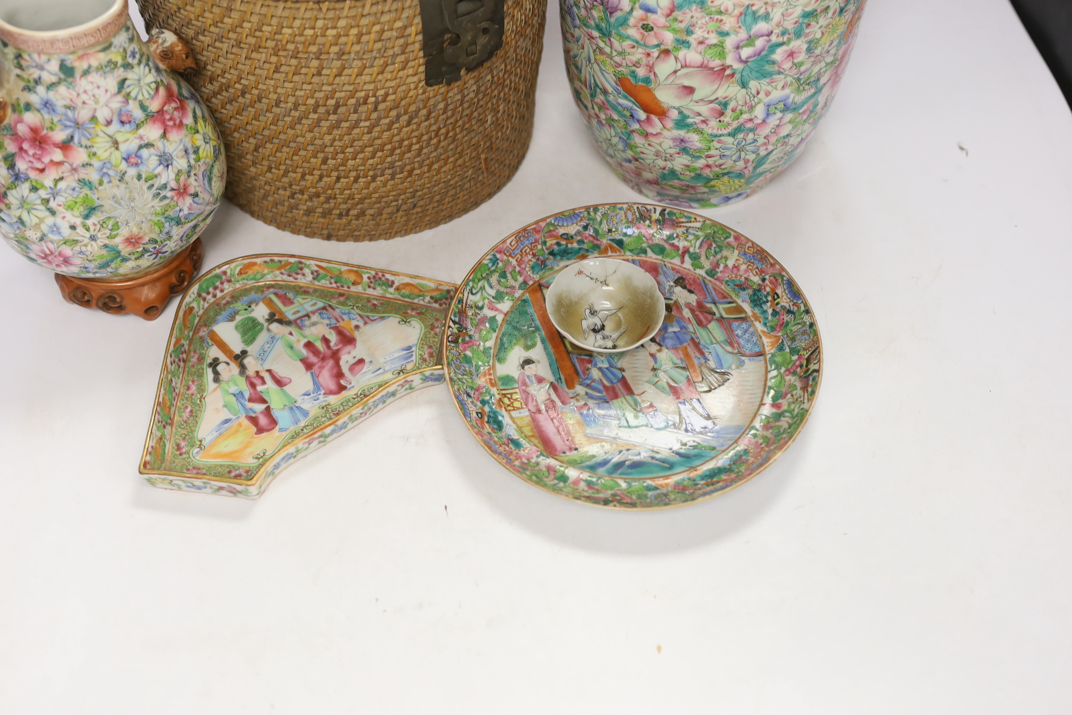 Two Chinese enamelled porcelain Millefleur vases, one with Qianlong Mark, both late 19th/early 20th century, together with two Chinese famille rose dishes and a similar basket cased tea kettle